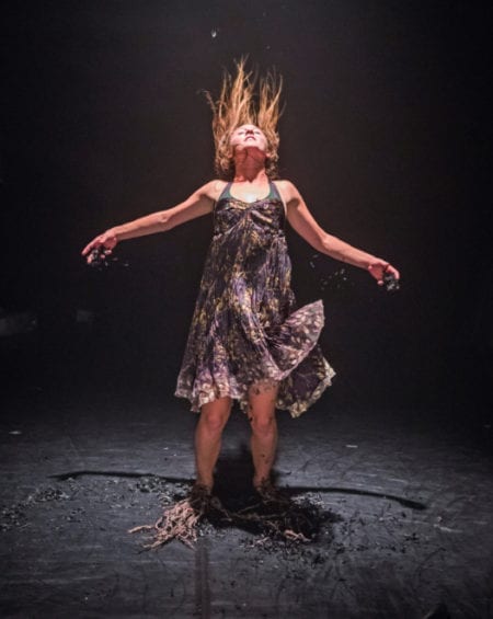 Image of a performer on dark background